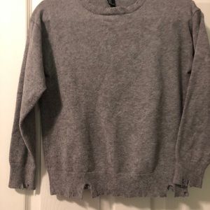 Medium ripped up knit sweater